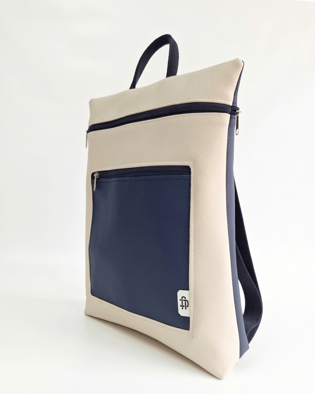 cristina-alba-mochila-mujer-antirrobo-reversible-136-crema-azul-marino